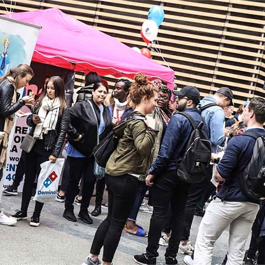 Students attending a freshers fair on campus