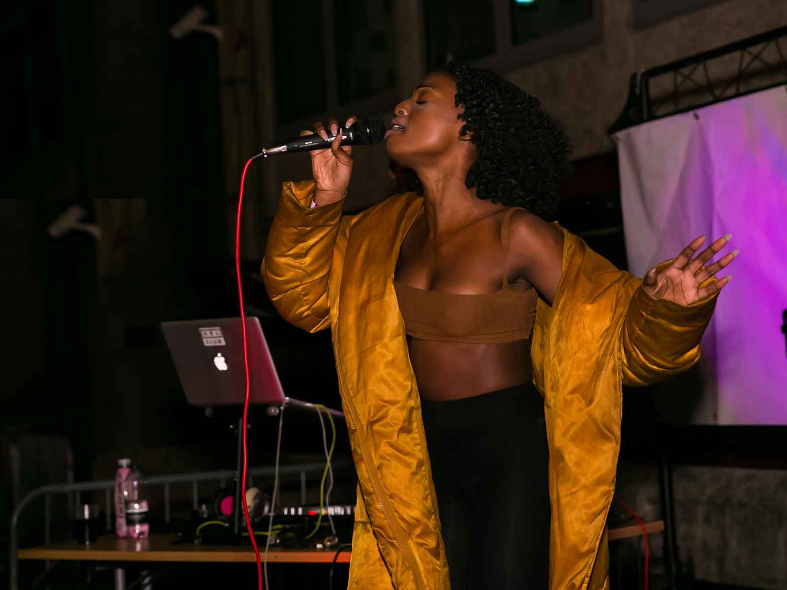 A student singing into a microphone