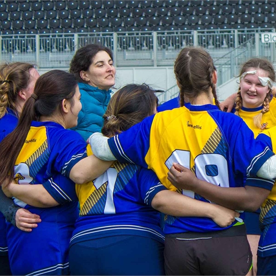 LSBSU's Women's Football team in a team huddle