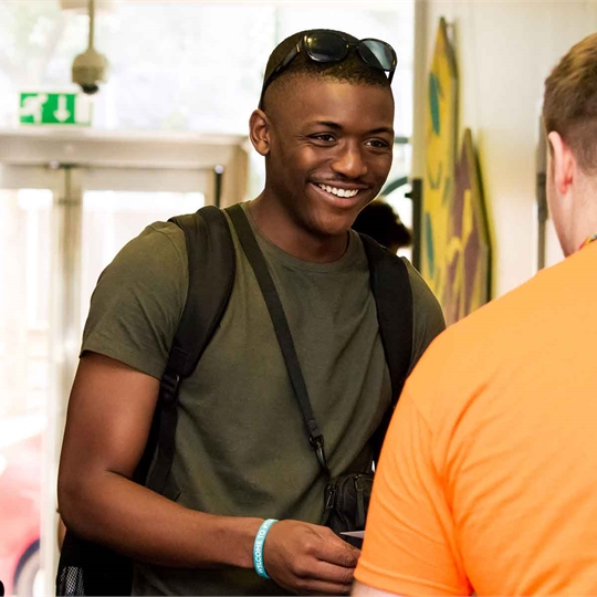 A student talking to a South Bank Students' Union staff member